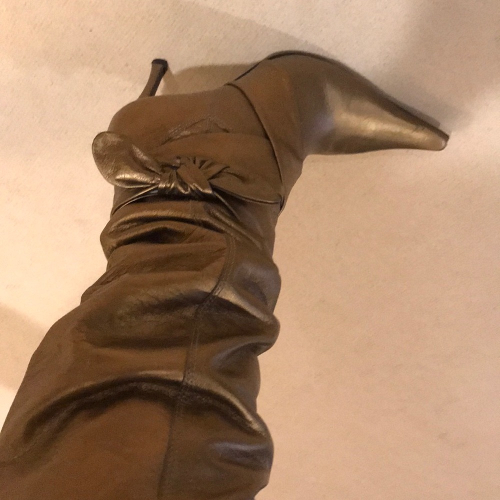 Knee-high gold boots